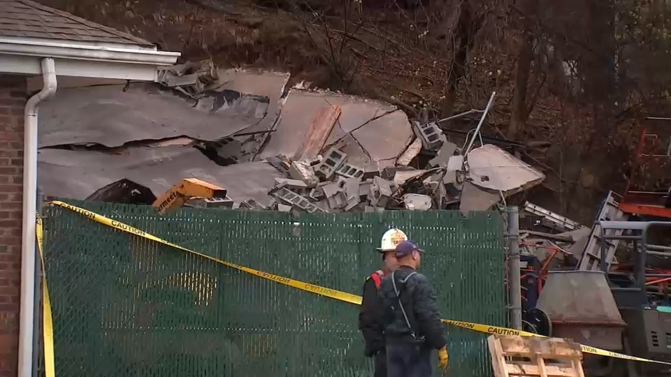 Boulder crashes into back of tool rental store, causing collapse