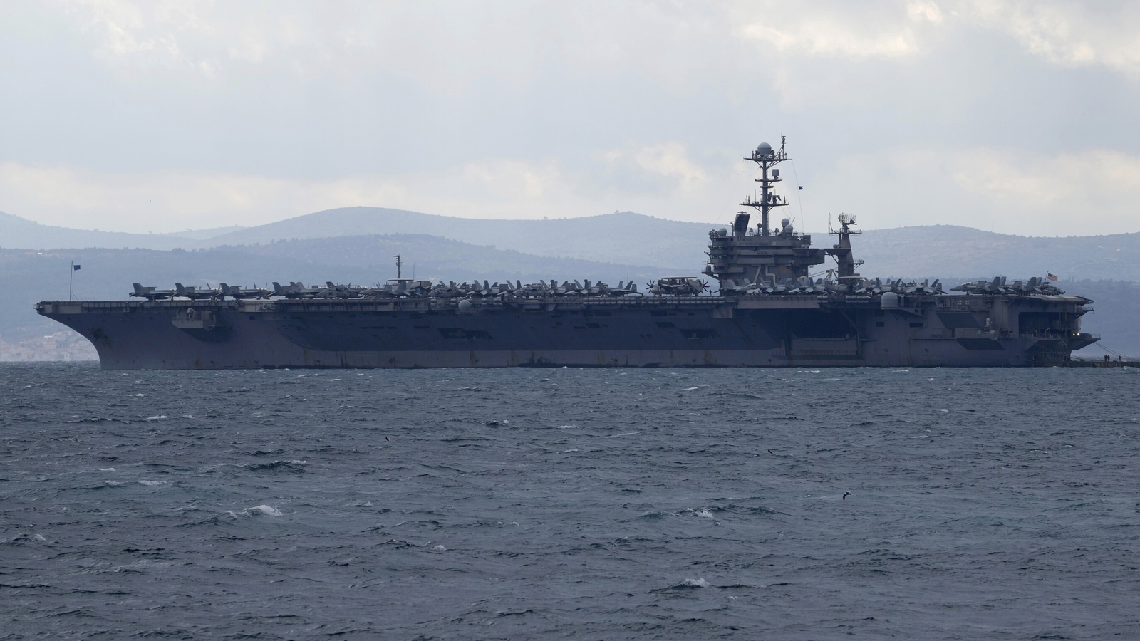 Fighter jet based out of NAS Lemoore slips off hangar deck of carrier in the Red Sea