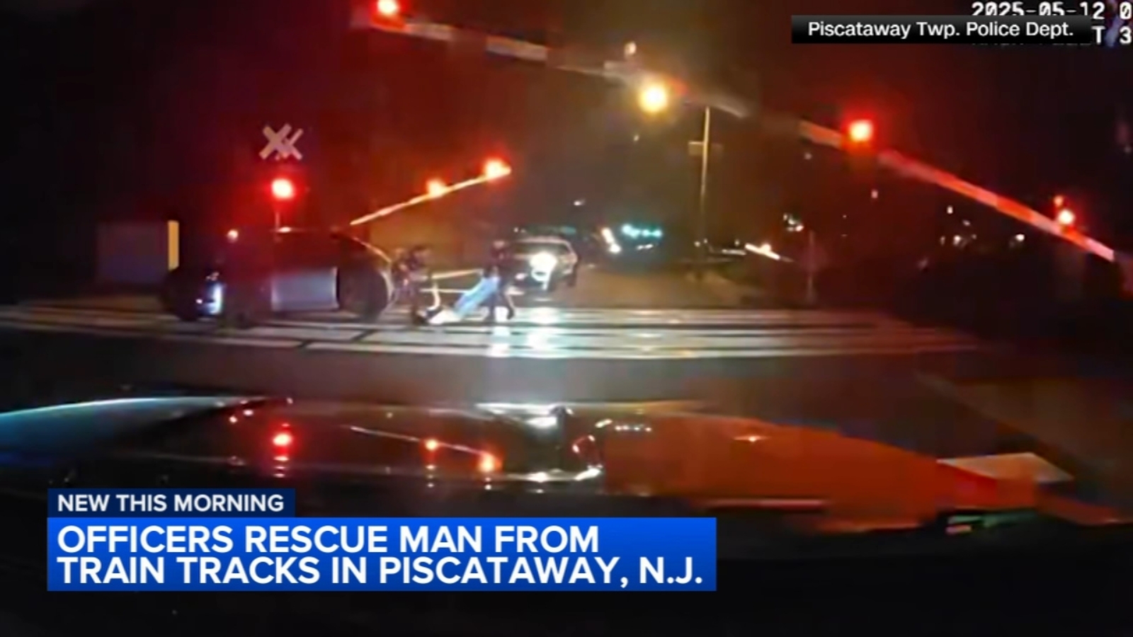 Police pull man to safety moments before car is hit by train in ...