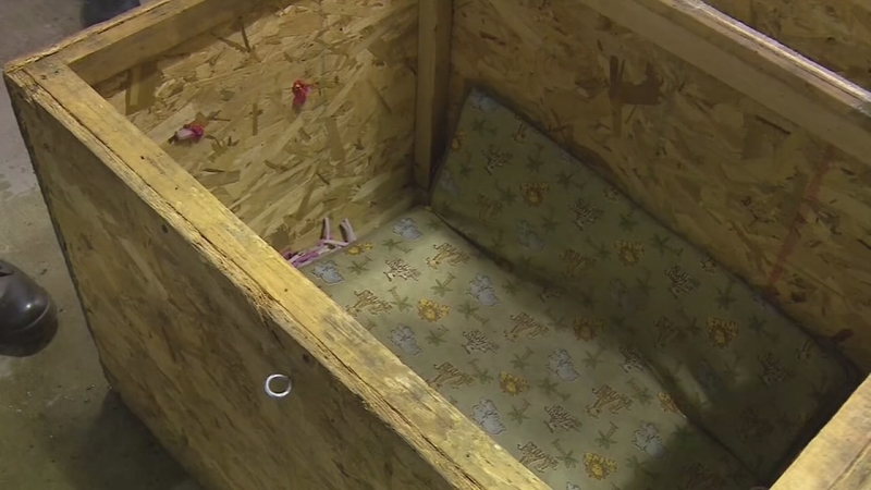9 charged after Indiana toddler found locked inside box, police say