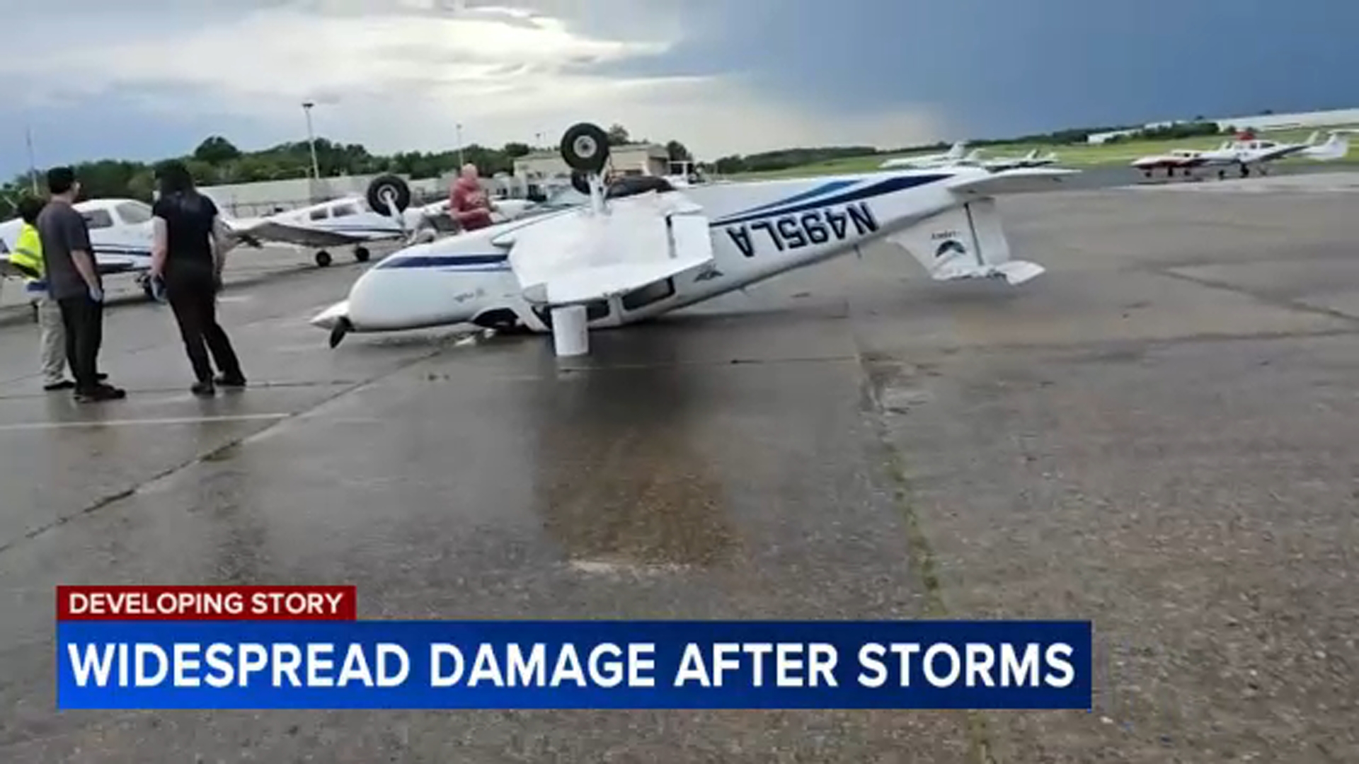 IMAGE: Storm flips unoccupied plane at Northeast Philadelphia Airport on June 19, 2025.