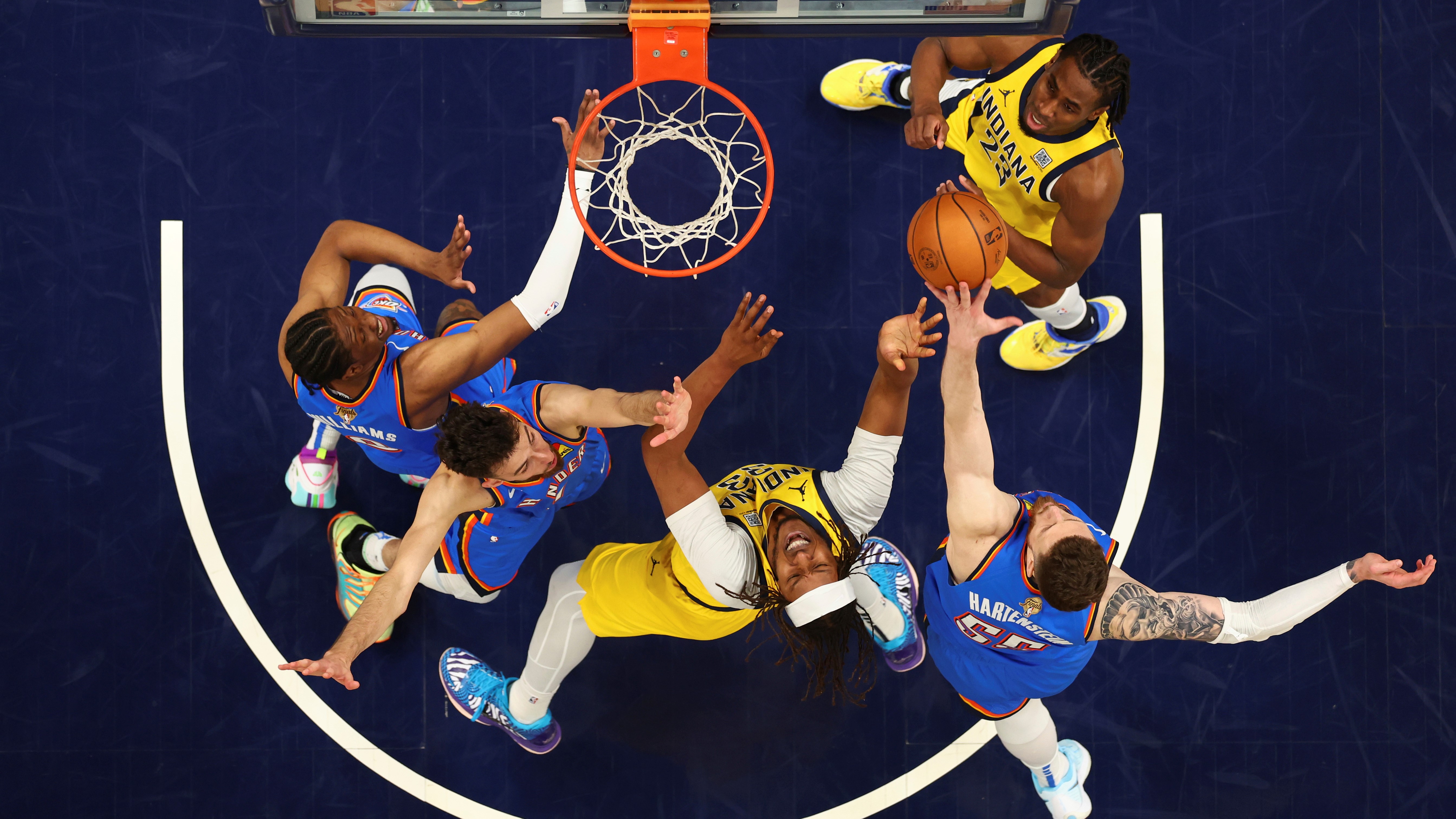 Indiana Pacers center Myles Turner drives to the basket against Oklahoma City Thunder forward Chet Holmgren during Game 6 of the NBA Finals June 19, 2025 in Indianapolis.