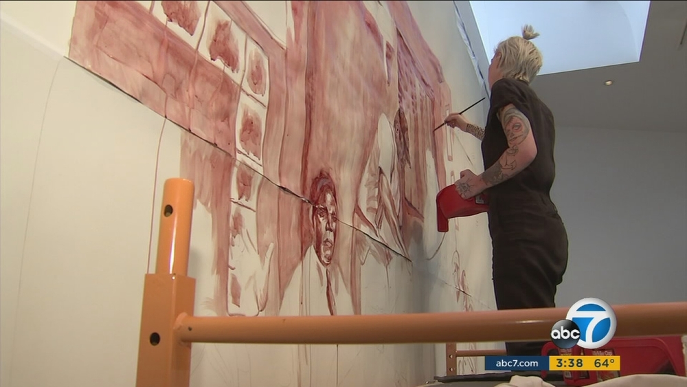 LA artist creates painting in blood as Trump protest