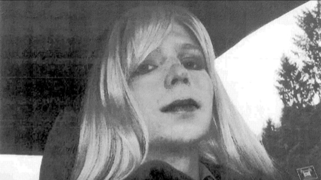 In this undated file photo provided by the U.S. Army, Pfc. Bradley Manning poses for a photo wearing a wig and lipstick. Manning later transitioned to being a woman named Chelsea.