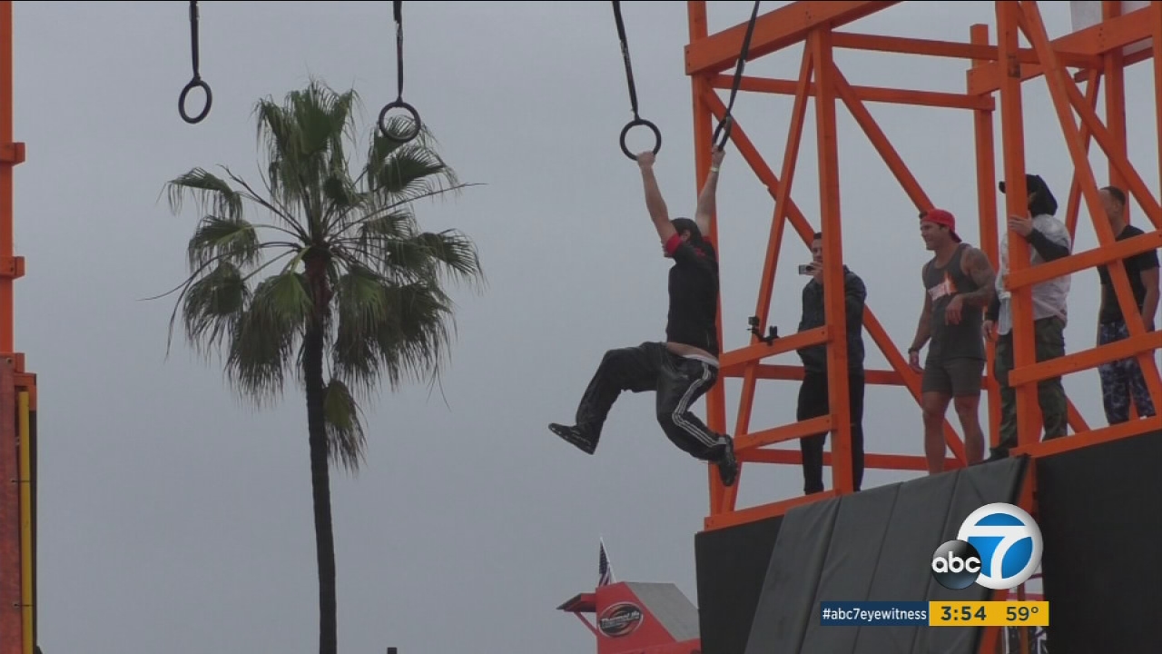 Rain fails to dampen spirits during Tough Mudder training at Venice's Muscle Beach