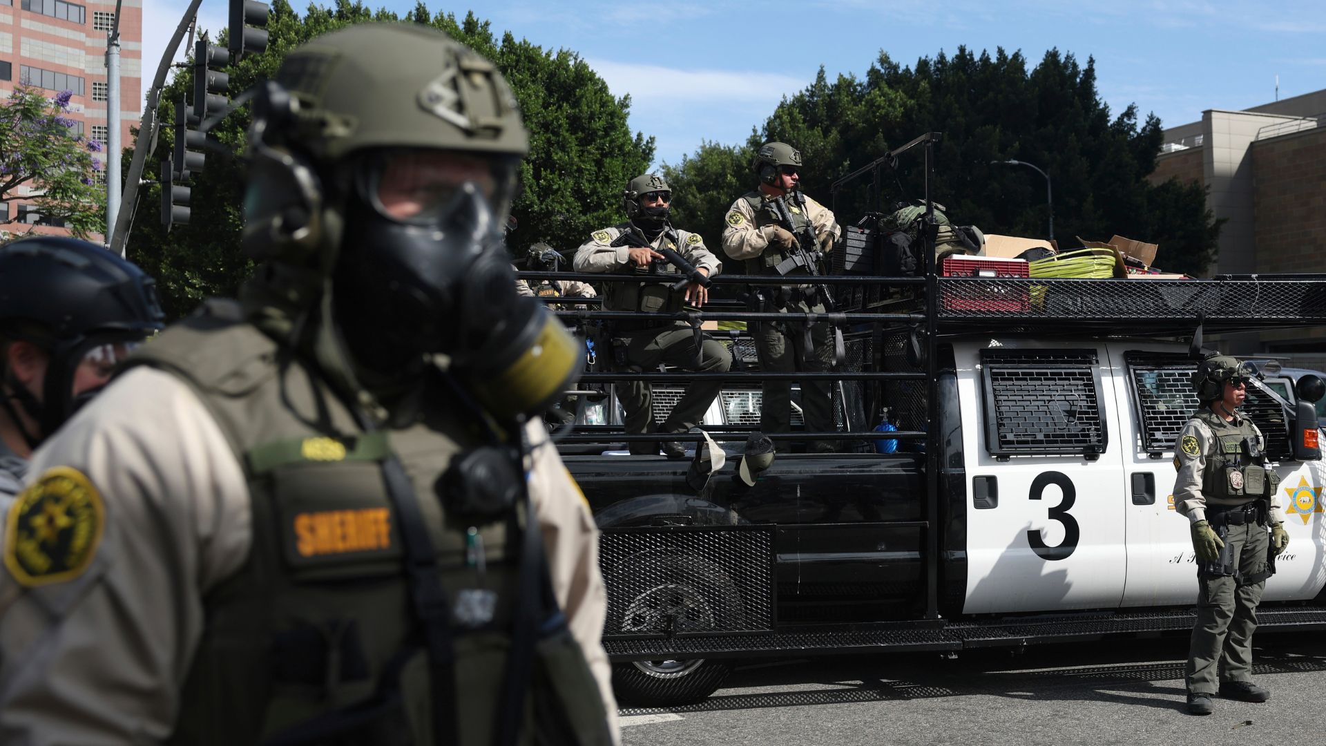 Law enforcement officers stand guard during a protest June 14, 2025, in Los Angeles.