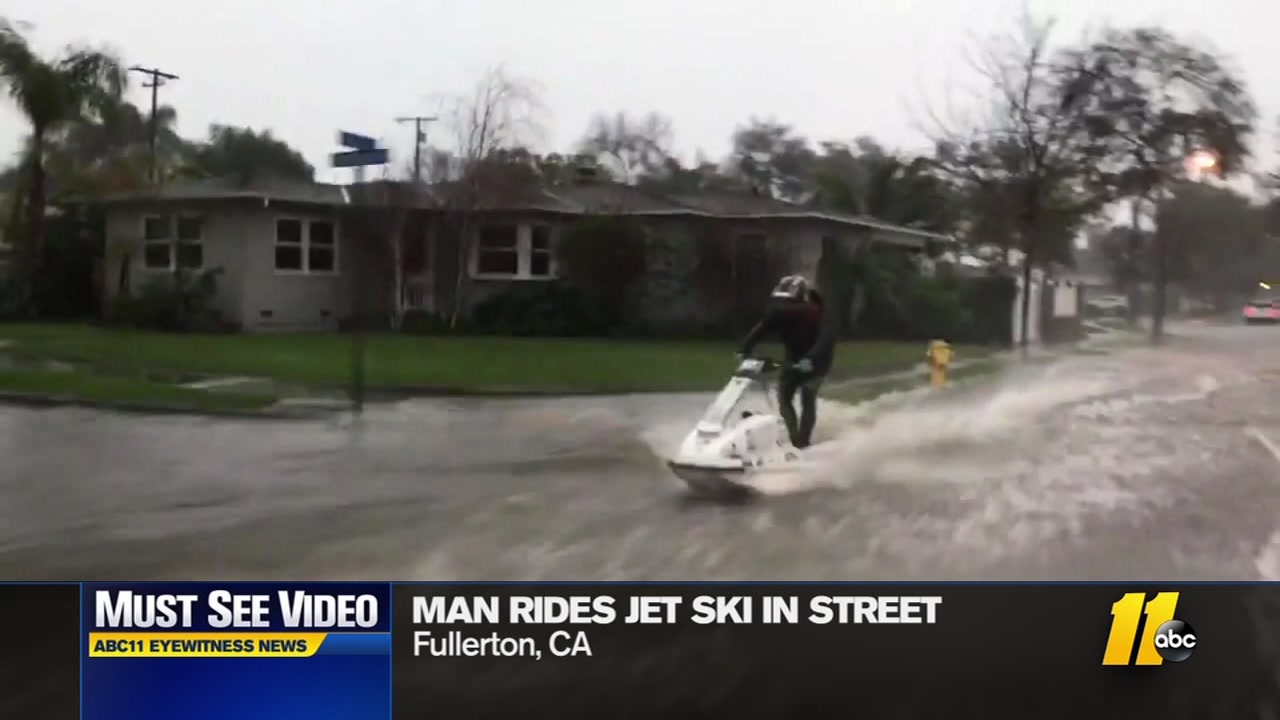 California man rides Jet Ski through flooded streets