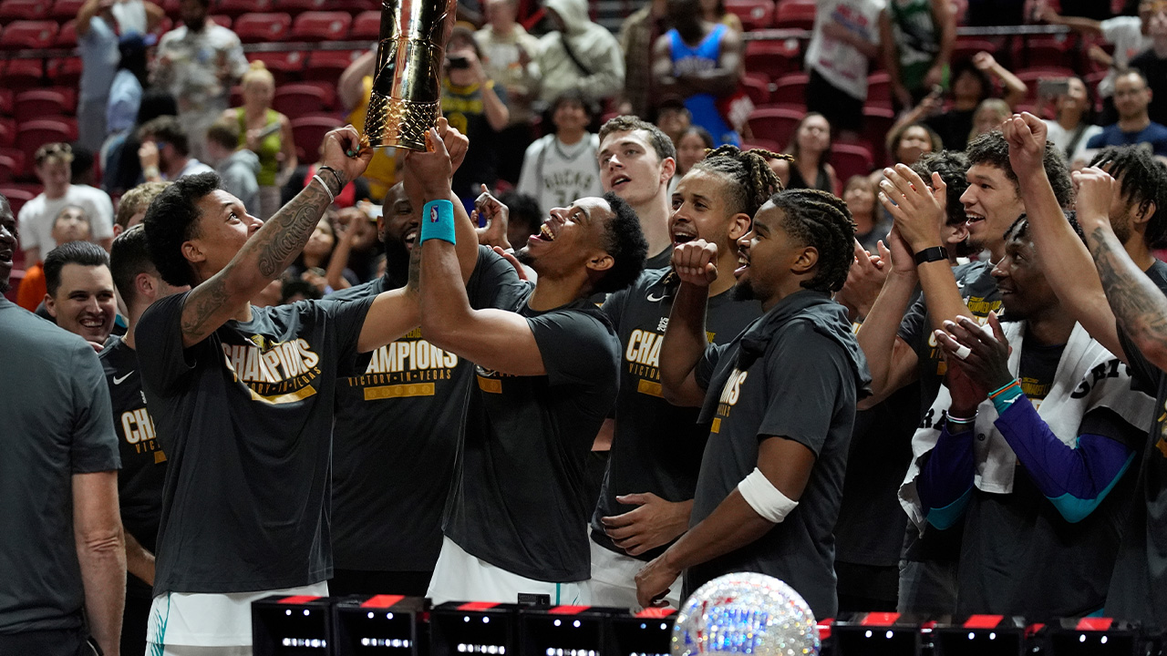 Charlotte Hornets players celebrate after defeating the Sacramento Kings in an NBA Summer League championship basketball game Sunday, July 20, 2025, in Las Vegas.