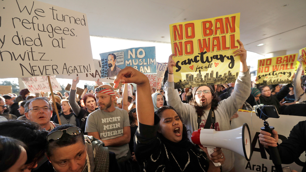 US judge temporarily blocks Trump's travel ban nationwide