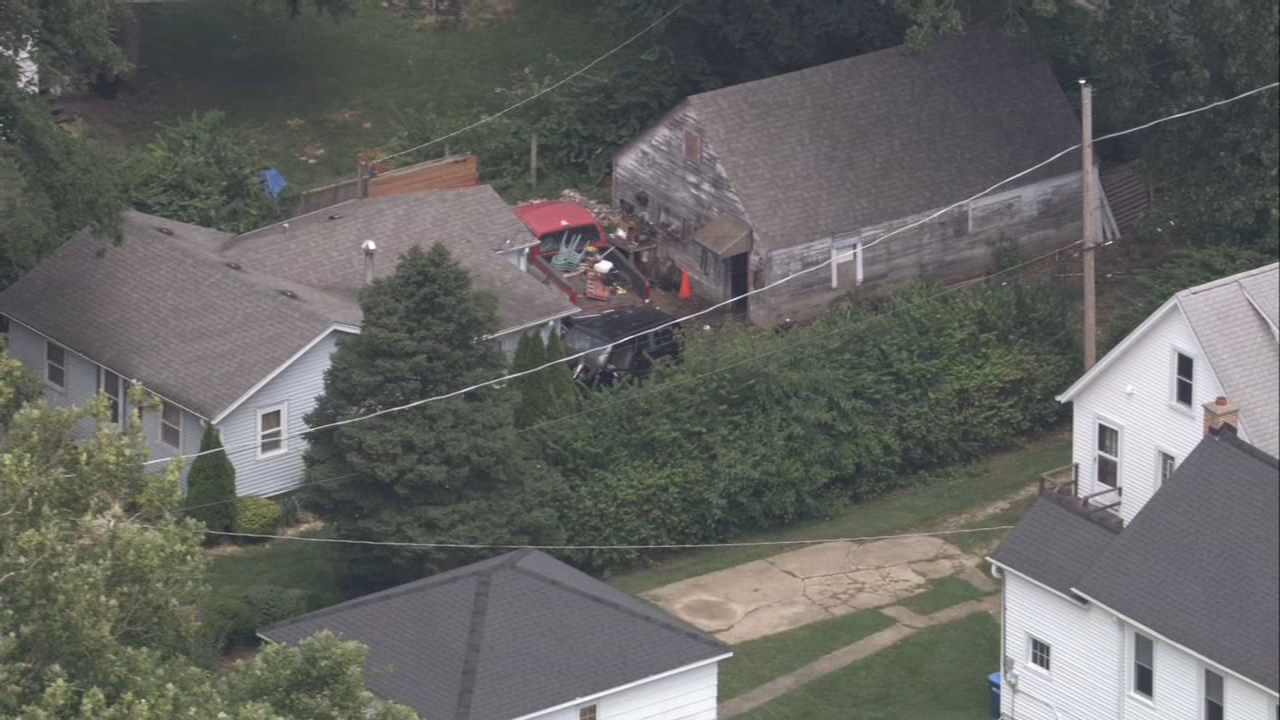 Fiery crash injures 1; car rams into suburban house, officials say