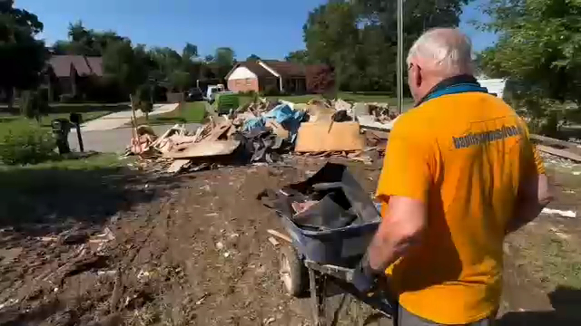 Volunteers help with cleanup efforts after flooding in Durham