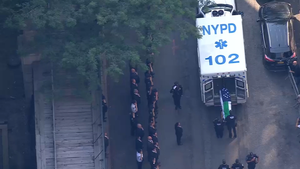 Dignified transfer of NYPD officer killed in Midtown mass shooting
