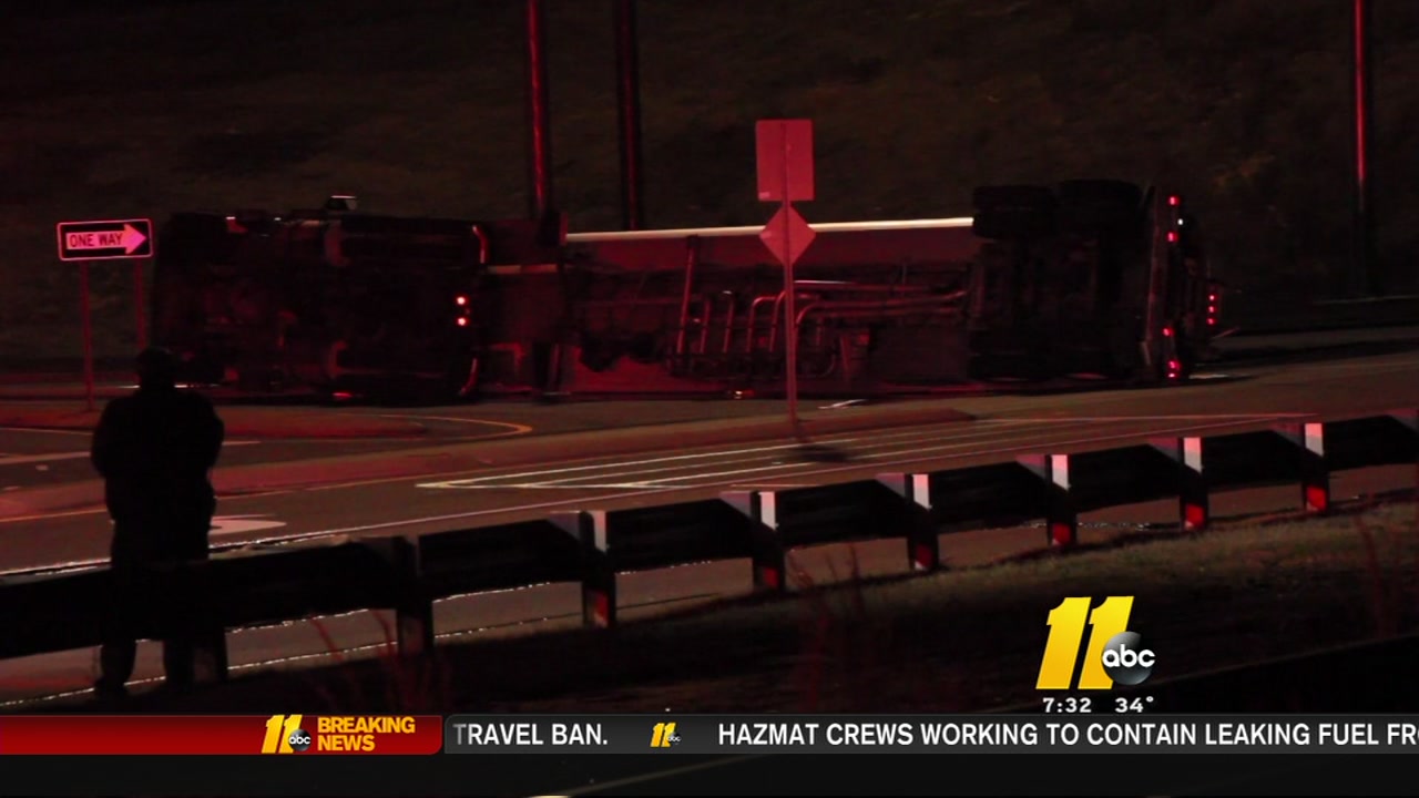 Fuel leaking from overturned tanker truck