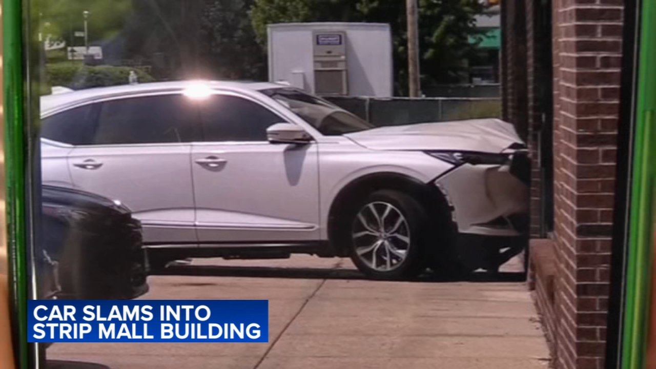 Vehicle crashes into fitness facility at north suburban strip mall