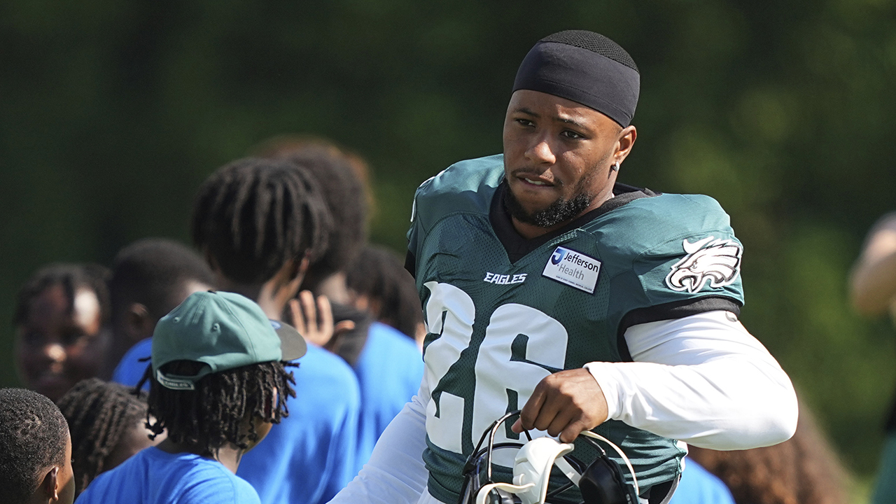 Philadelphia Eagles running back Saquon Barkley greets fans as he runs onto the field during an NFL football training camp, Monday, July 28, 2025, in Philadelphia.