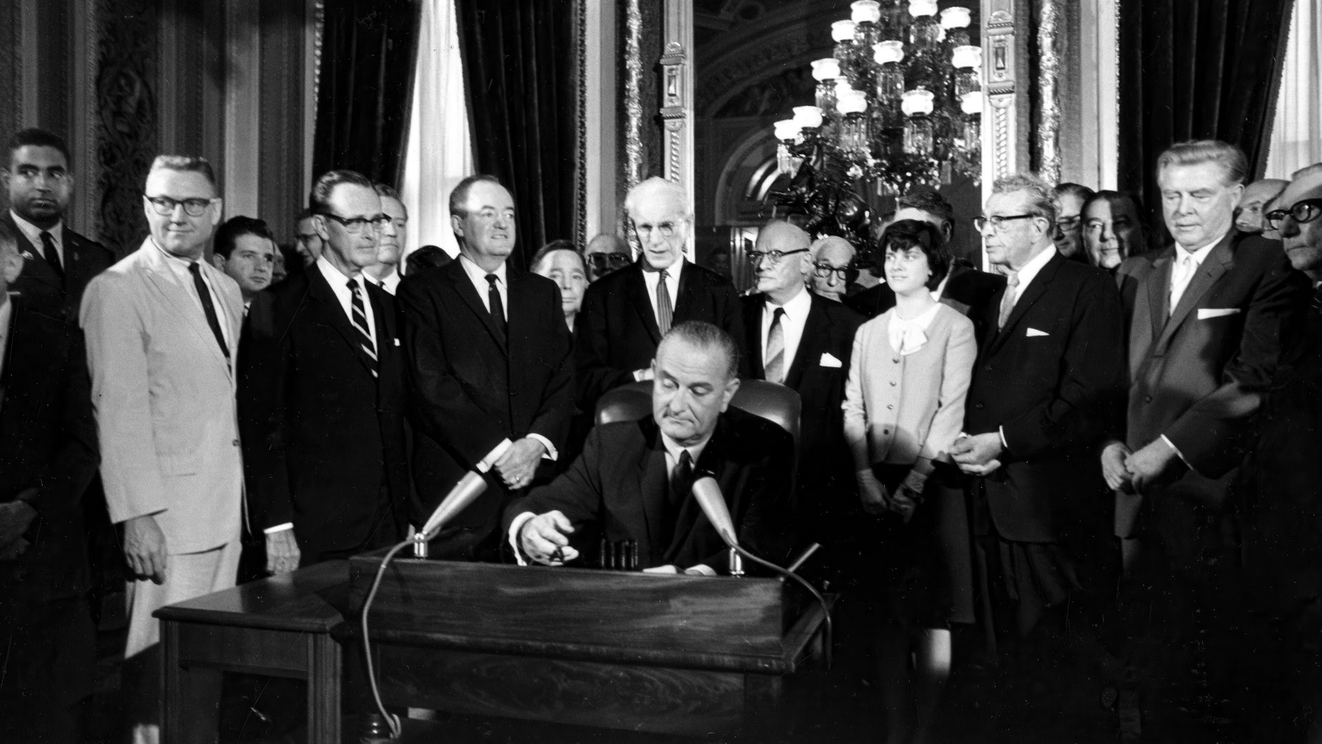 President Lyndon B. Johnson signs the Voting Rights Act of 1965 in a ceremony in the President's Room near the Senate chambers in Washington, Aug. 6, 1965.