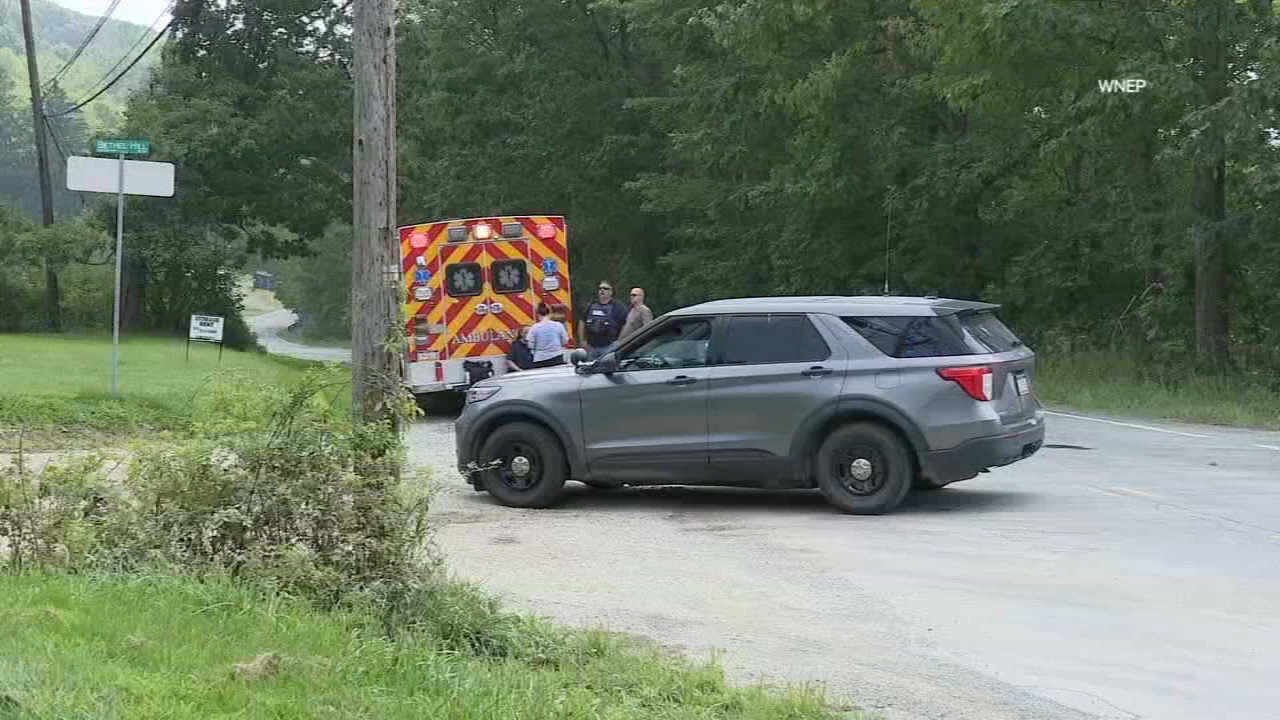 Woman killed by neighbor before 2 responding Pennsylvania troopers wounded in ambush shooting