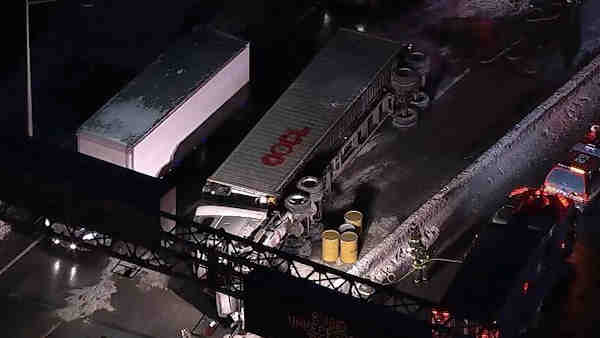 Tractor-trailer flips on Van Wyck