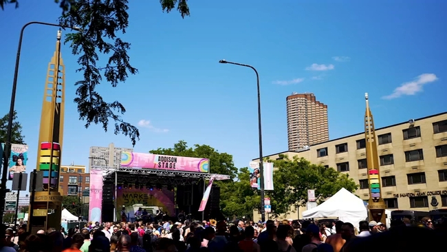 Vibrant community market day with vendors and visitors