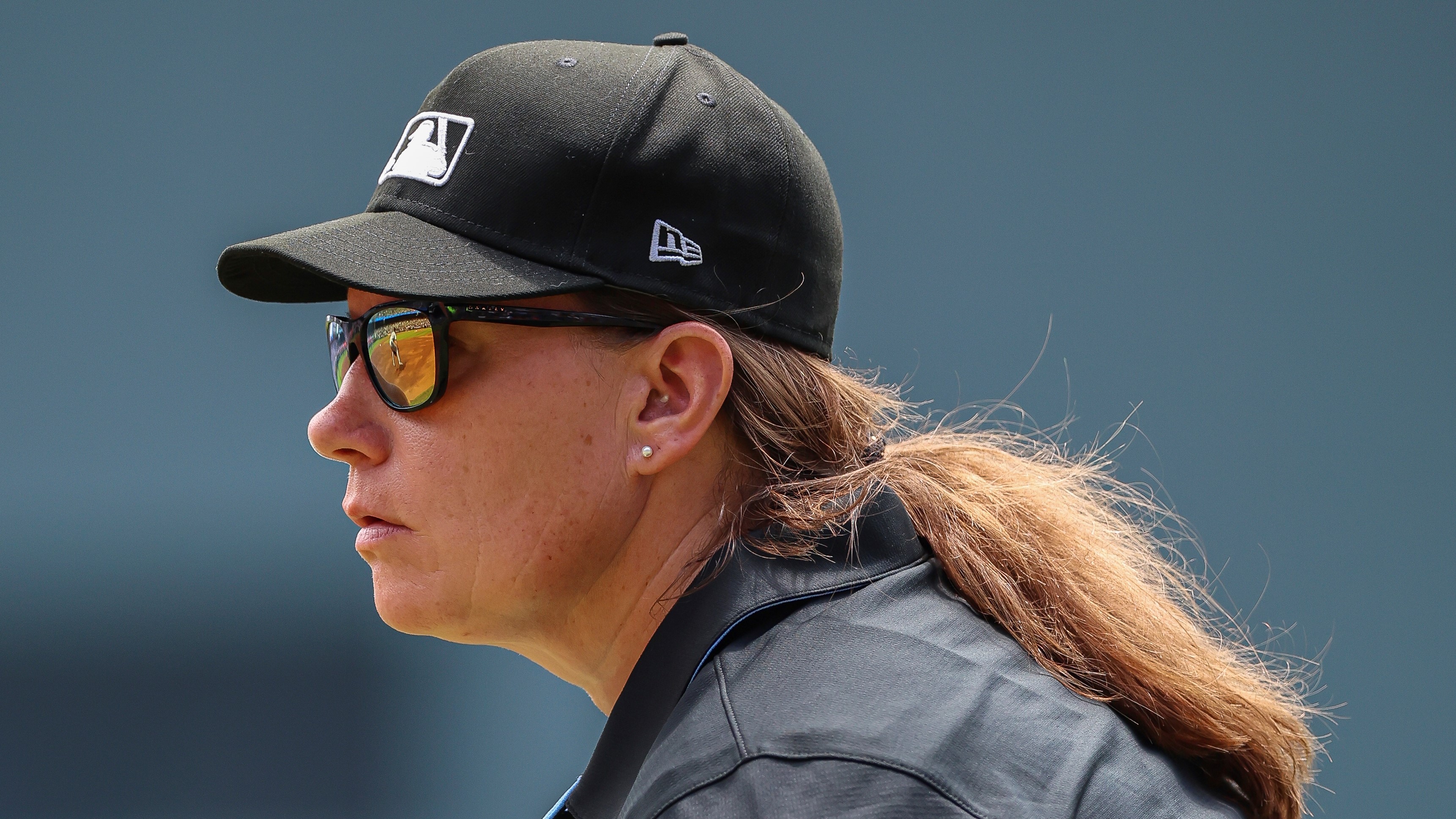 Umpire Jen Pawol, looks on during the first inning of a baseball game of a doubleheader between the Atlanta Braves and Miami Marlins, Saturday, Aug. 9, 2025, in Atlanta.