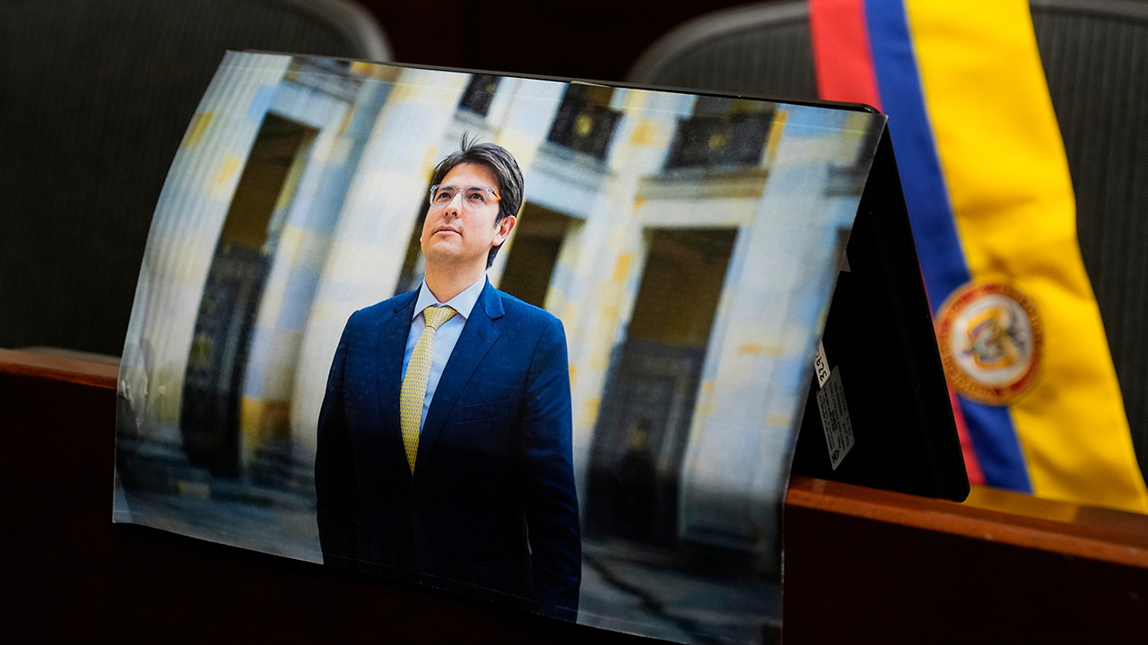 A photo of opposition Sen. Miguel Uribe is placed at his seat in Congress in Bogota, Colombia, Monday, Aug. 11, 2025, after his death.