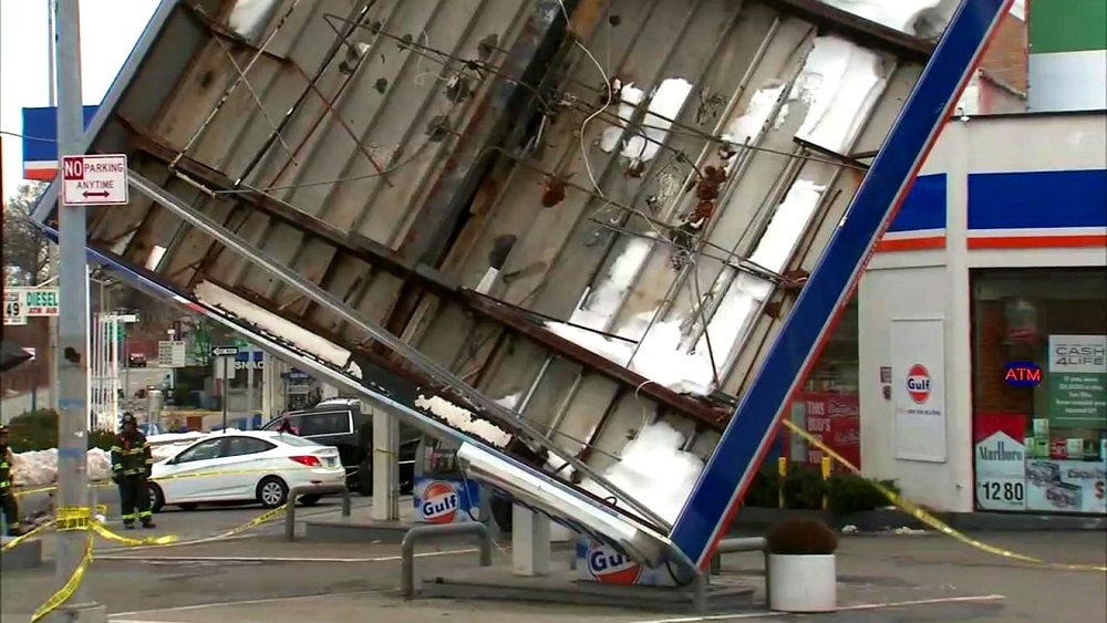 Strong winds topple gas station roof in Queens; damage throughout area