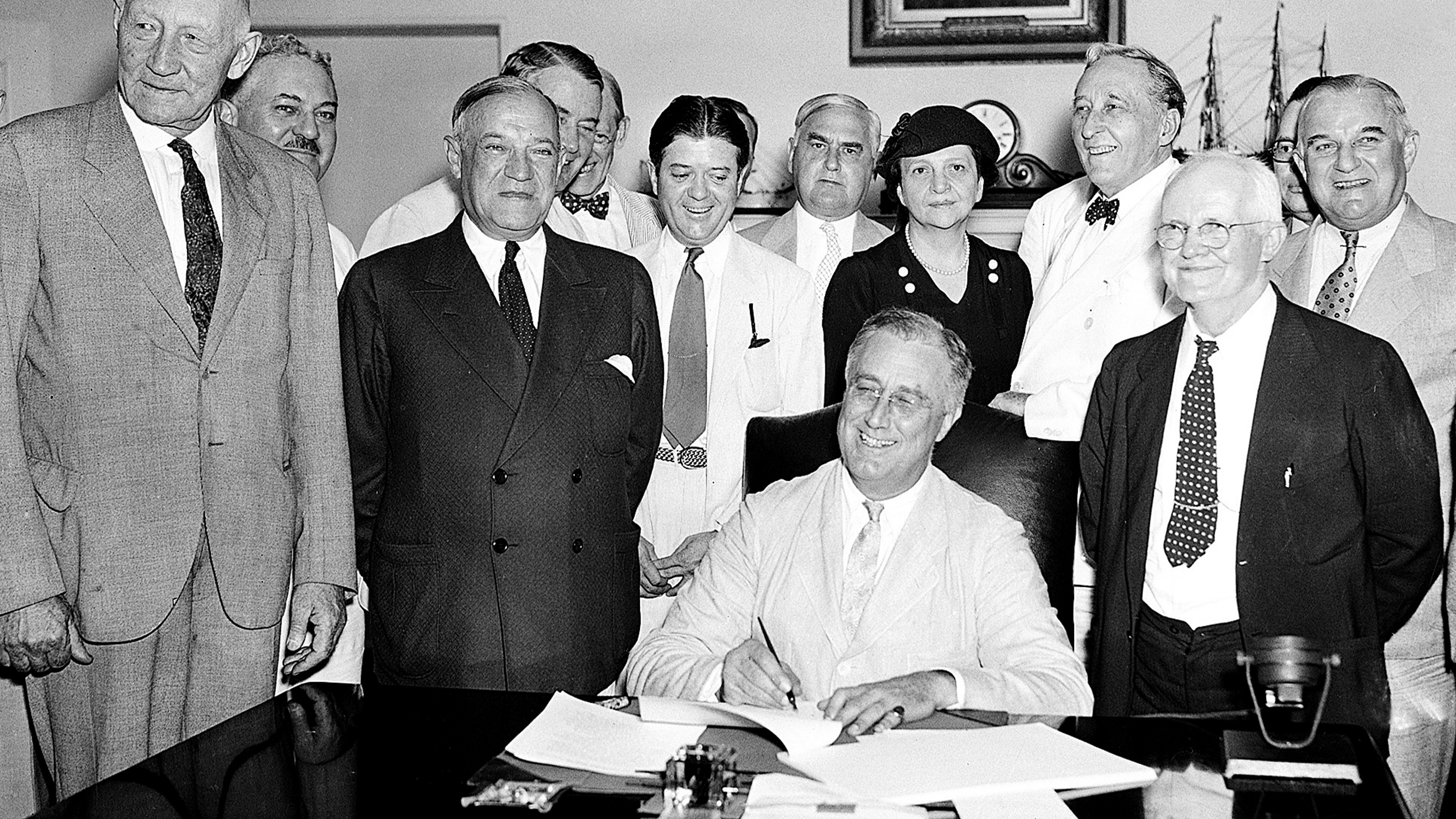 FILE - President Franklin Roosevelt signs the Social Security Bill in Washington Aug. 14, 1935.
