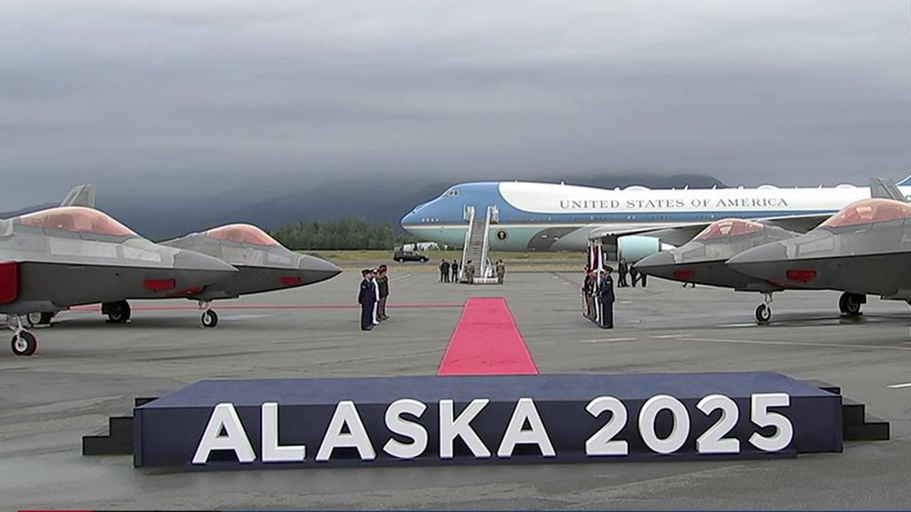 Air Force One and an Alaska 2025 sign are seen on the tarmac at Joint Base Elmendorf-Richardson in Anchorage on Friday, Aug. 15, 2025.