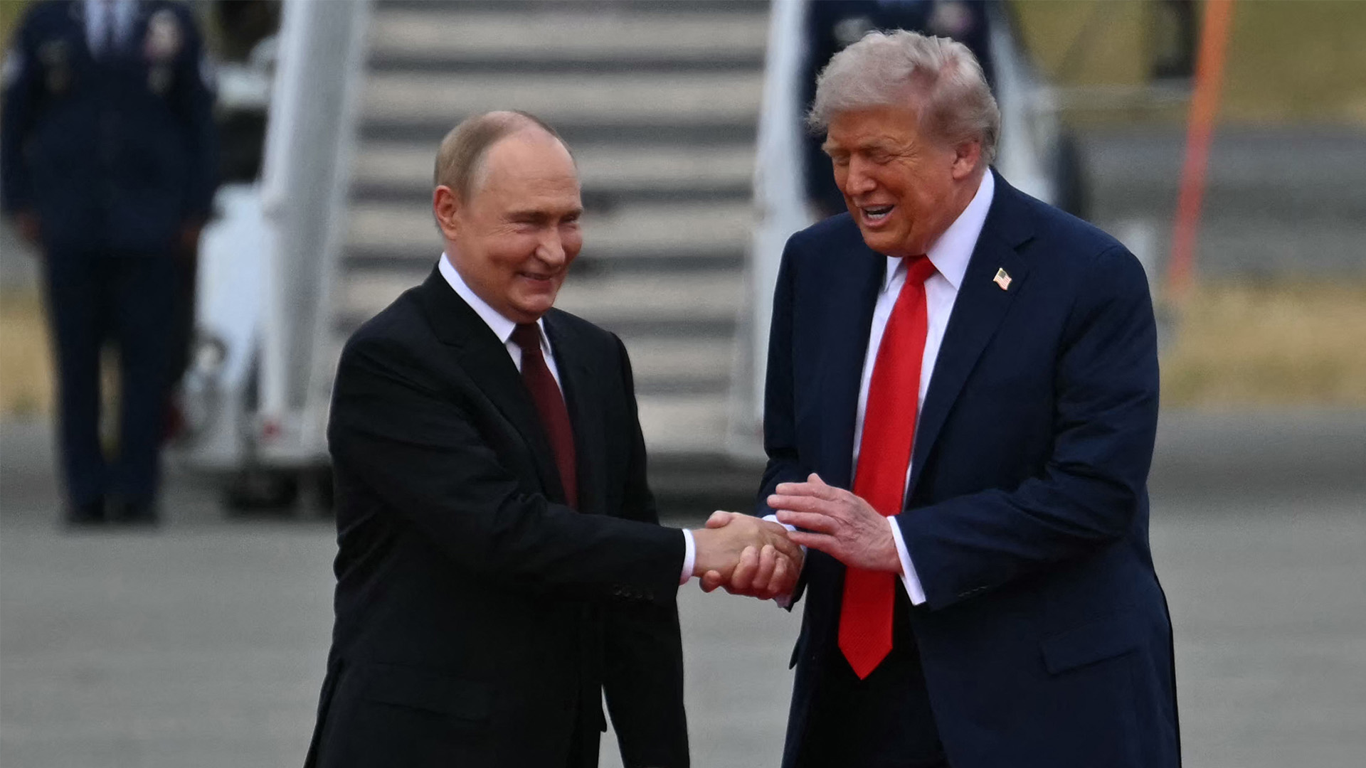 President Donald Trump greets Russian President Vladimir Putin on the tarmac after they arrived at Joint Base Elmendorf-Richardson in Anchorage, Alaska, on August 15, 2025.