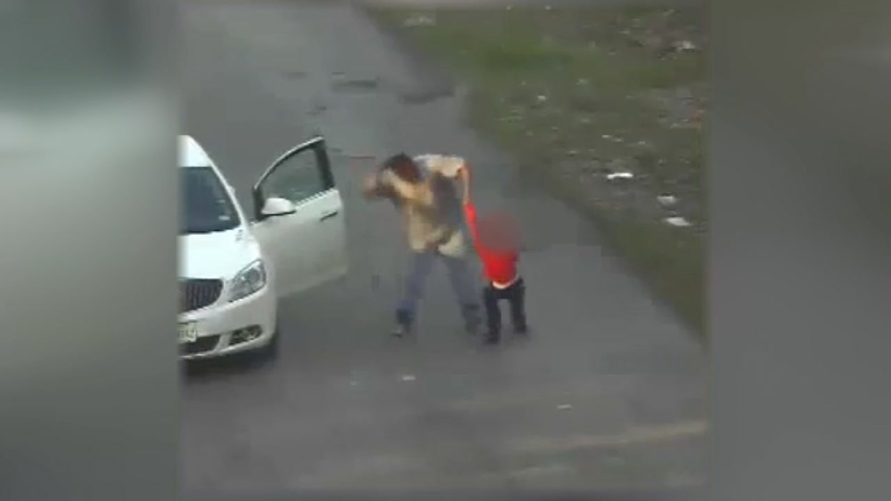 Child beating caught on cameras monitoring illegal dumping