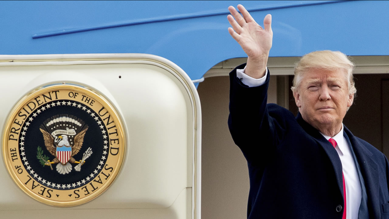 President Donald Trump waves before boarding Air Force One at Andrews Air Force Base in Md., Friday, Feb. 17, 2017.