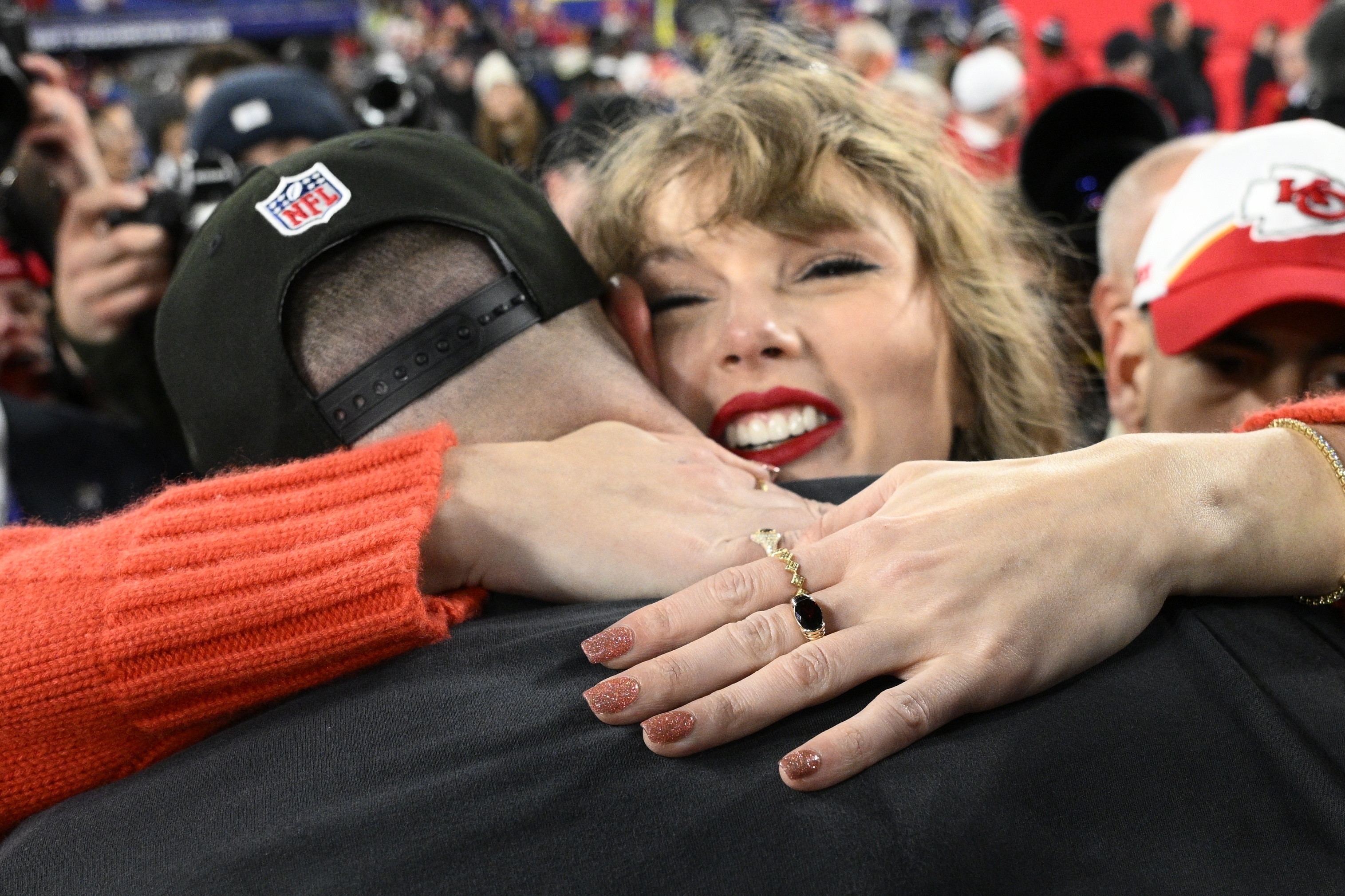 Taylor Swift embraces Kansas City Chiefs tight end Travis Kelce (87) after the AFC Championship NFL football game, Sunday, Jan. 28, 2024, in Baltimore.