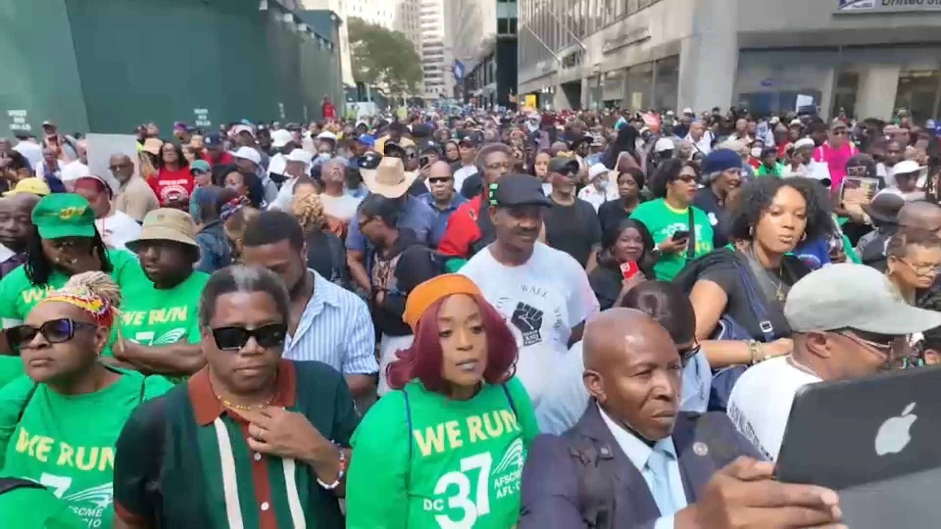 Thousands march on Wall Street to demand economic reforms and equity