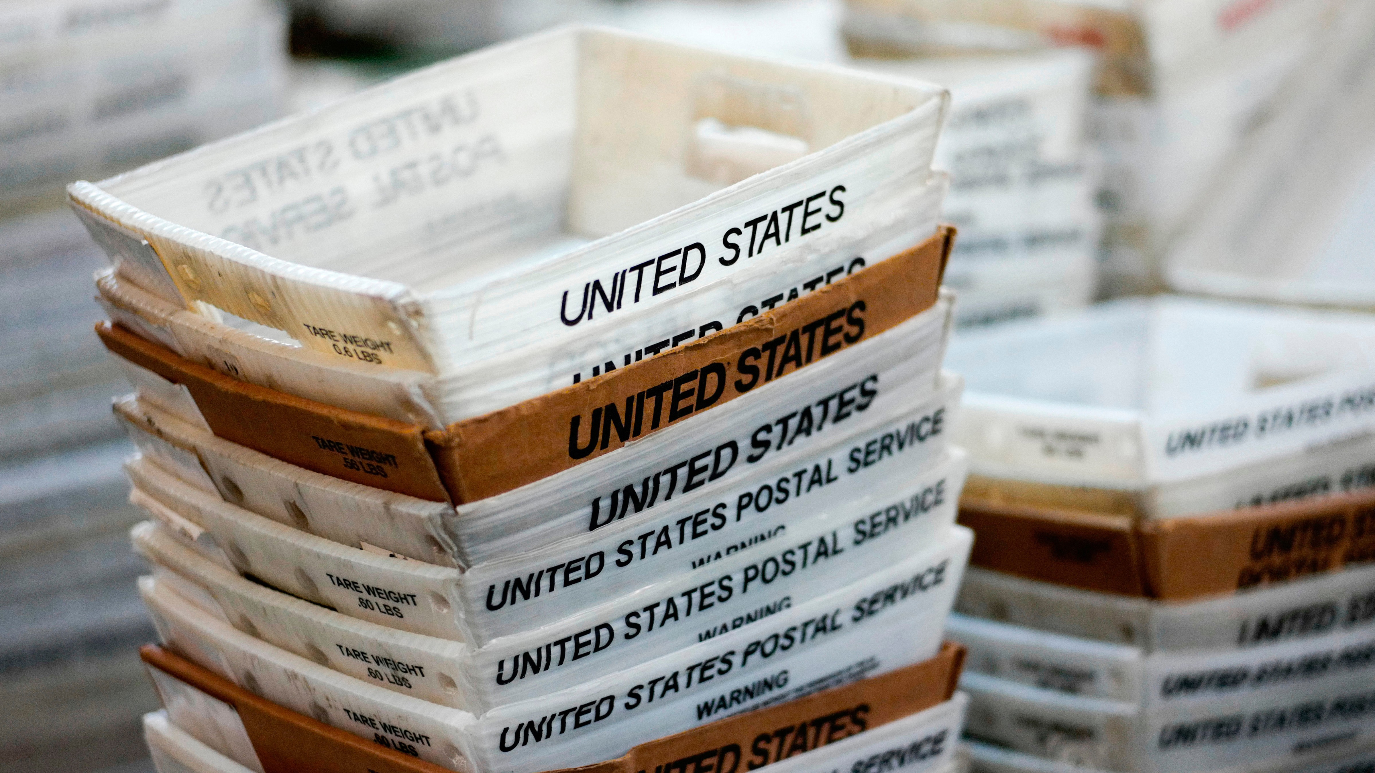 Tariffs on small-value packages go into effect as loophole ends
