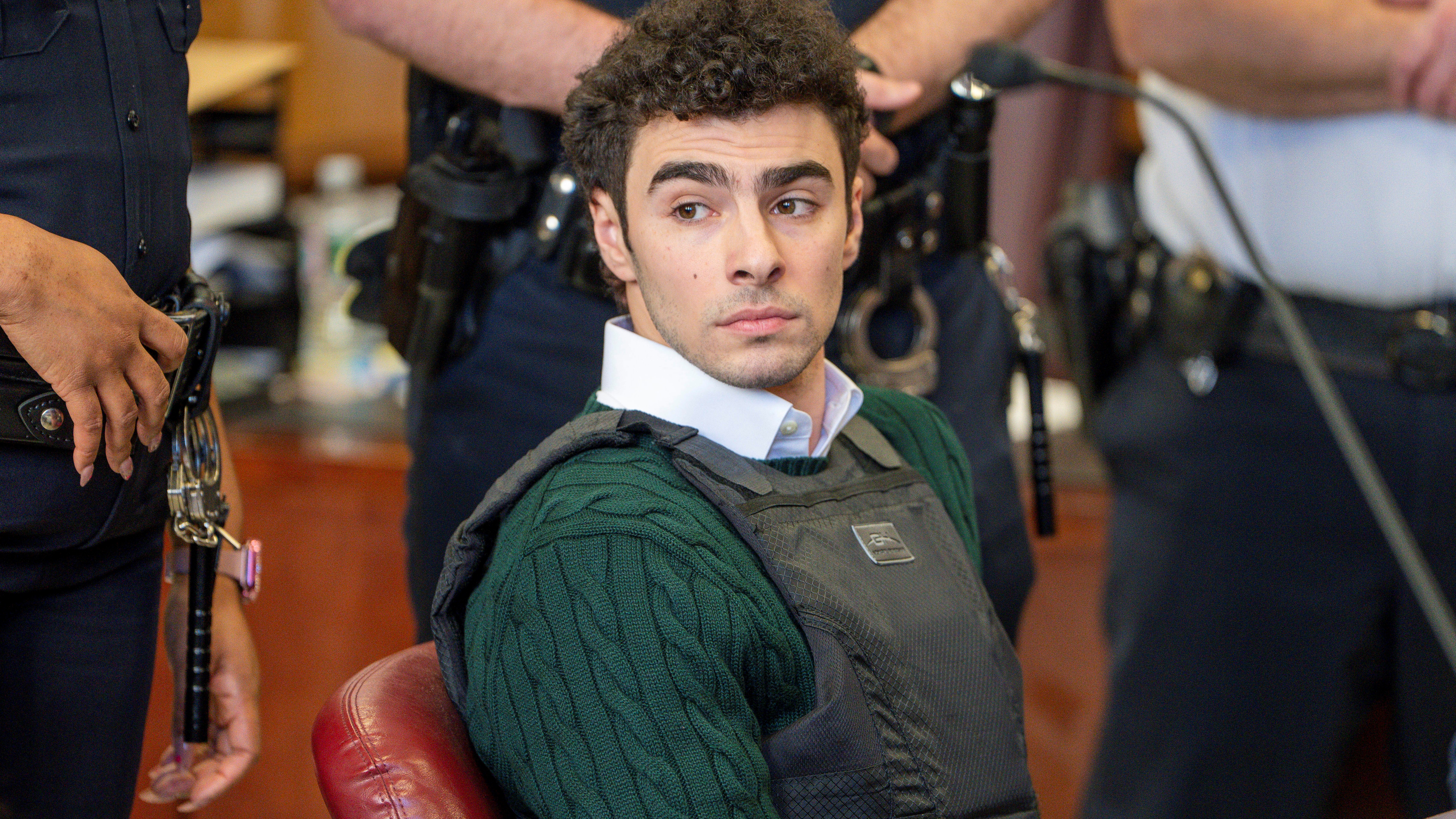 Luigi Mangione, accused of fatally shooting the UnitedHealthcare CEO Brian Thompson in New York City and leading authorities on a five-day search, appears in court for a hearing.