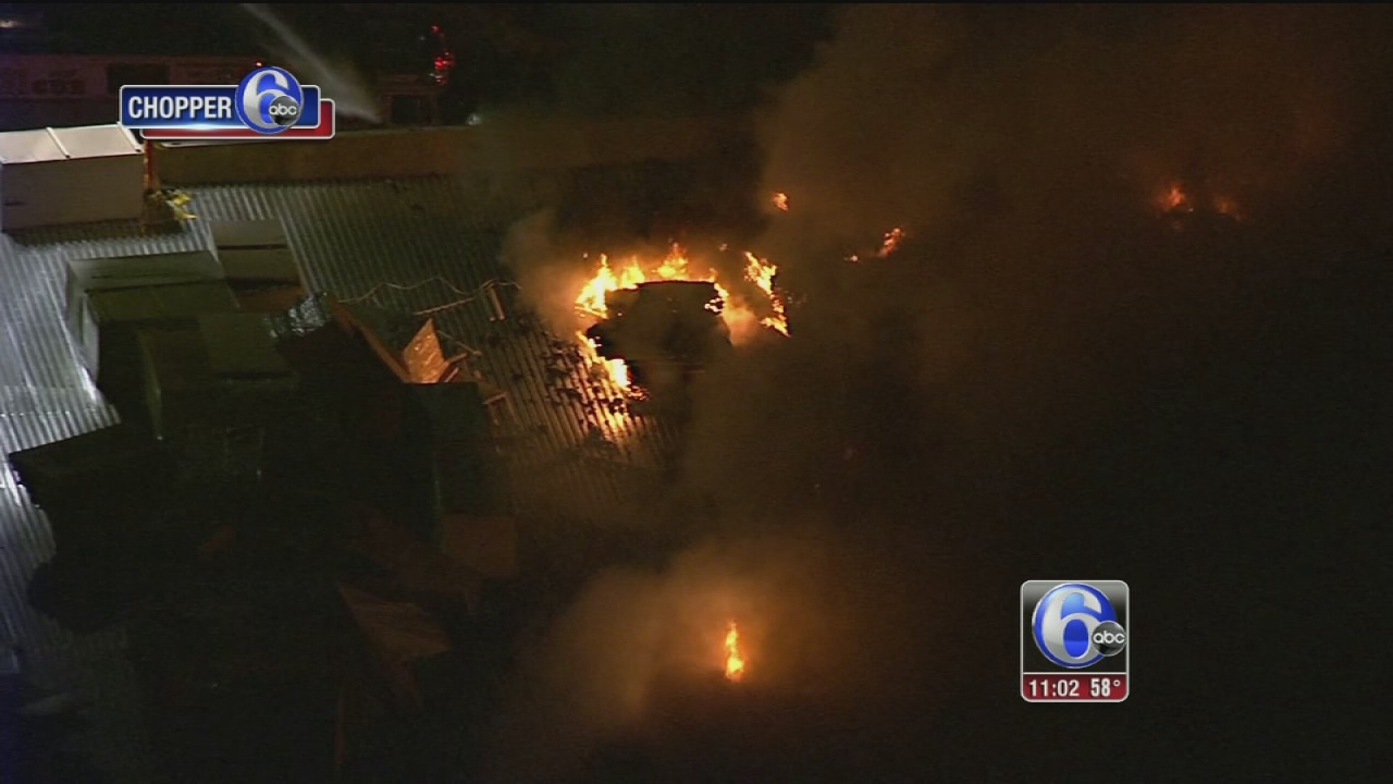 Firefighters battle building fire in Logan Township