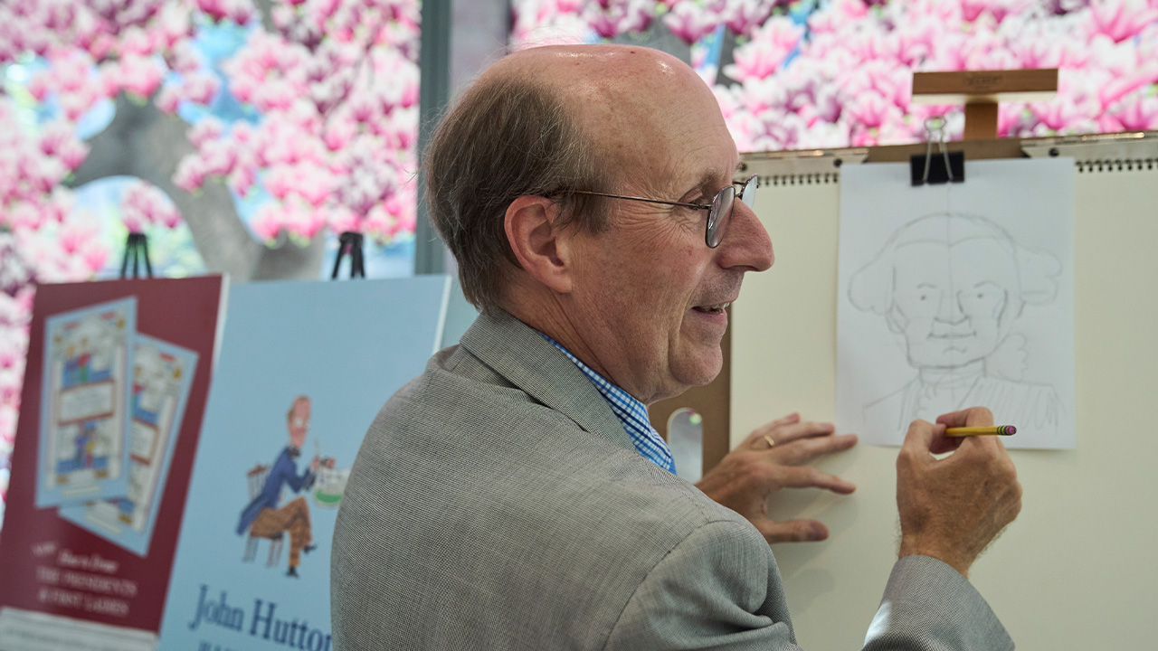 John Hutton, illustrator and professor of art history at Salem College, draws a picture of President George Washington, Tuesday, Aug. 12, 2025.