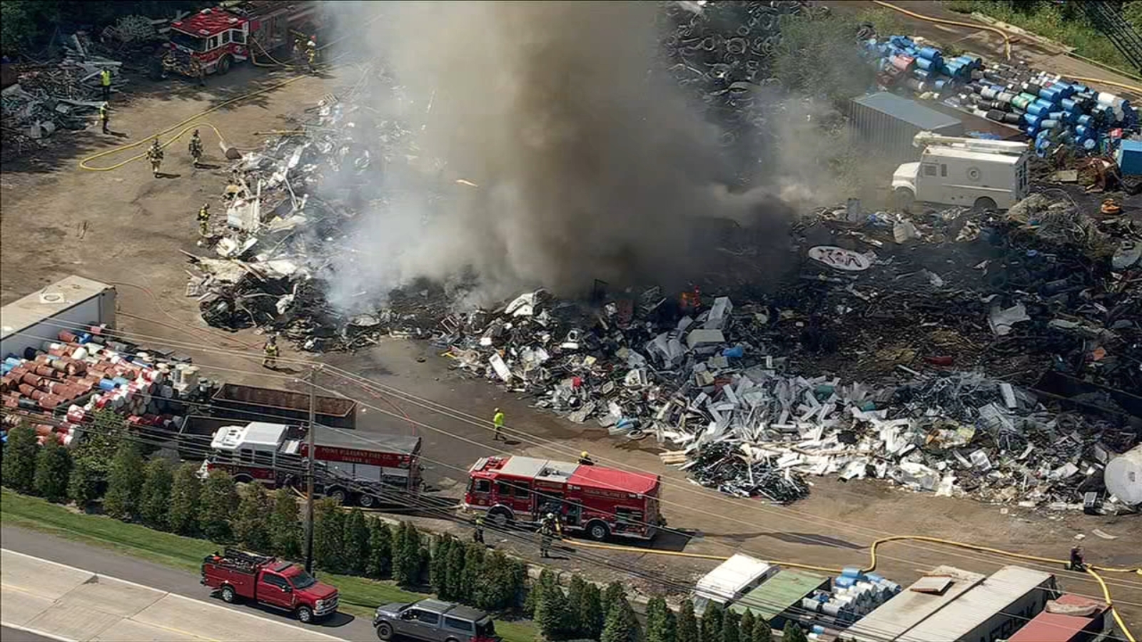 Firefighters battle large junkyard fire on Easton Road in ...