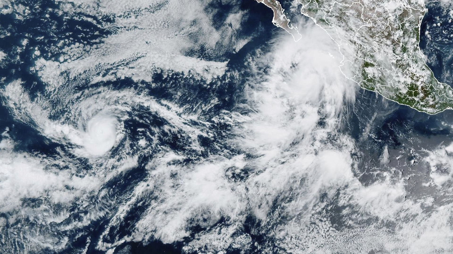 Tropical Storm Lorena (top right) off the west coast of Mexico, and Hurricane Kiko (left) in the open waters of the eastern Pacific, September 2, 2025. (NOAA via AP)