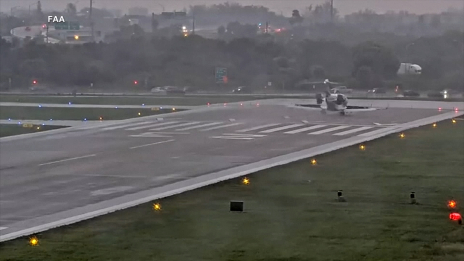 Bombardier jet overshoots runway near busy road, safety system prevents tragedy