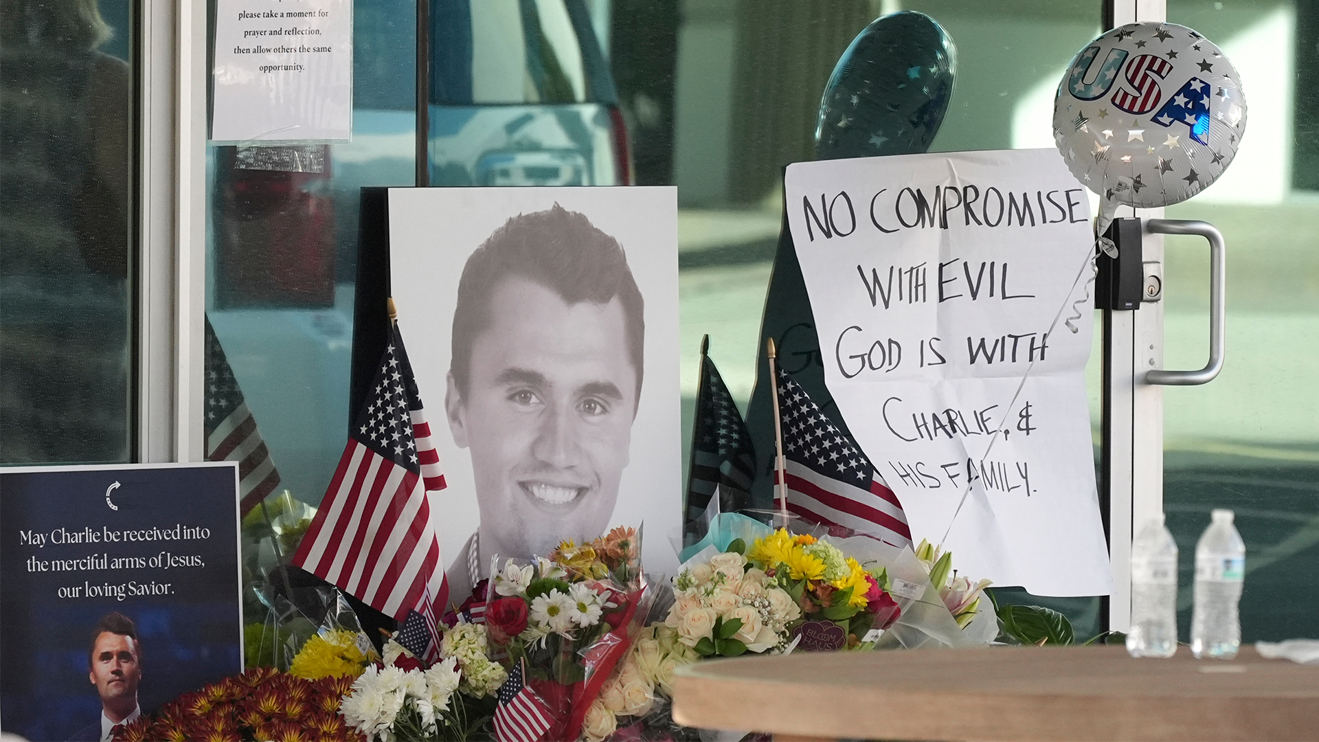 Well-wishers pay their respects at a makeshift memorial at the national headquarters of Turning Point USA on Wednesday, Sept. 10, 2025, in Phoenix.