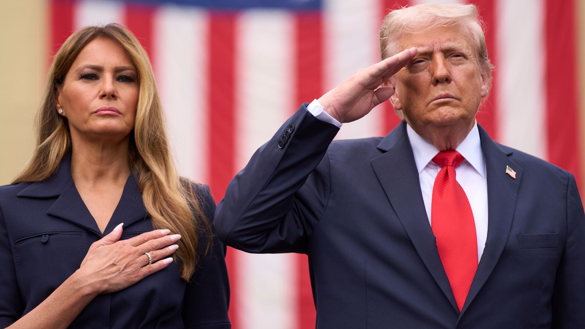 President Donald Trump and first lady Melania Trump stand as Taps is played during a ceremony to commemorate the 24th anniversary of the 9/11 attacks, at the Pentagon in Washington