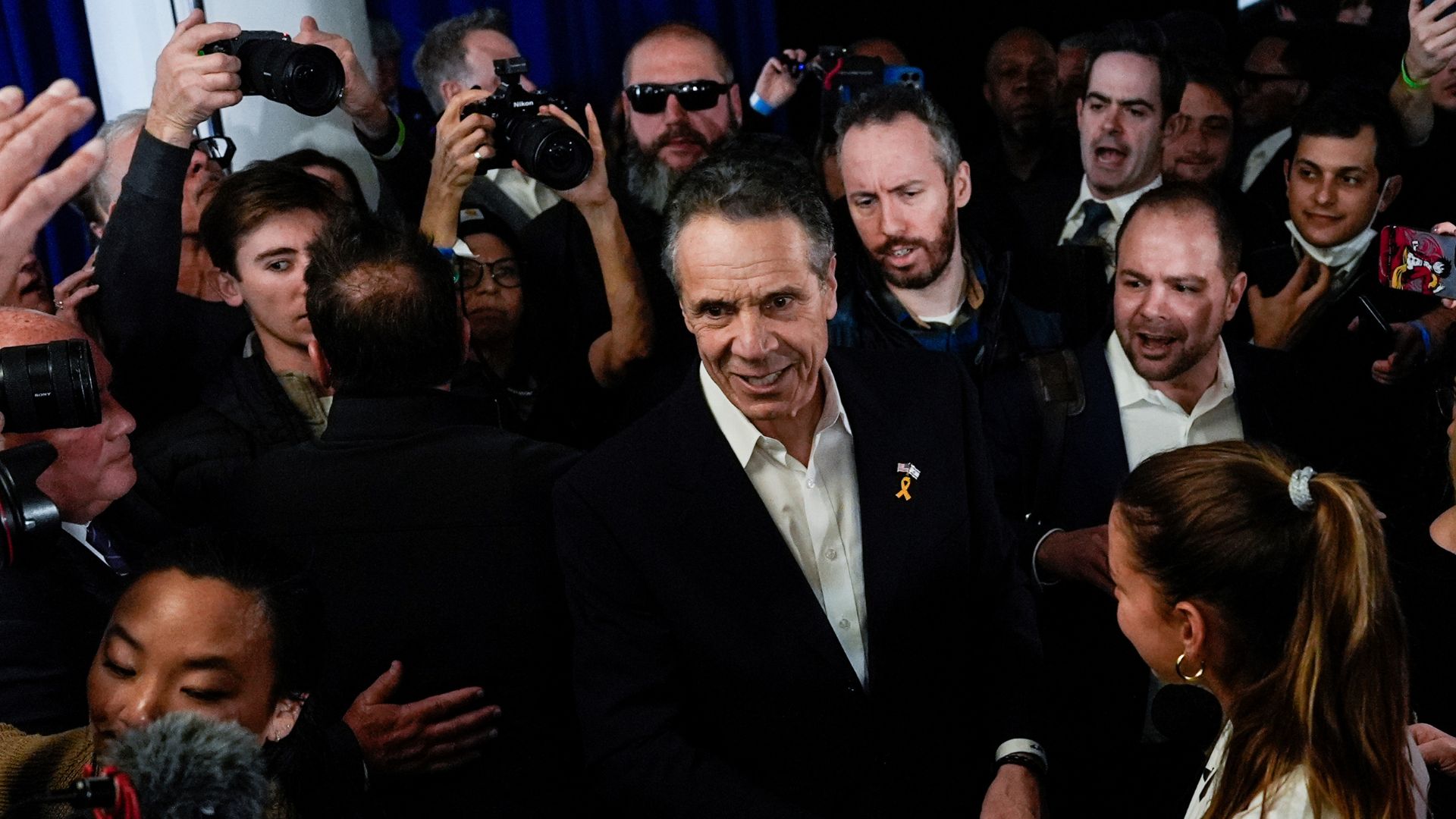 Former New York Gov. Andrew Cuomo, center, speaks with supporters at the New York City District Council of Carpenters while campaigning for mayor of New York City, March 2, 2025.
