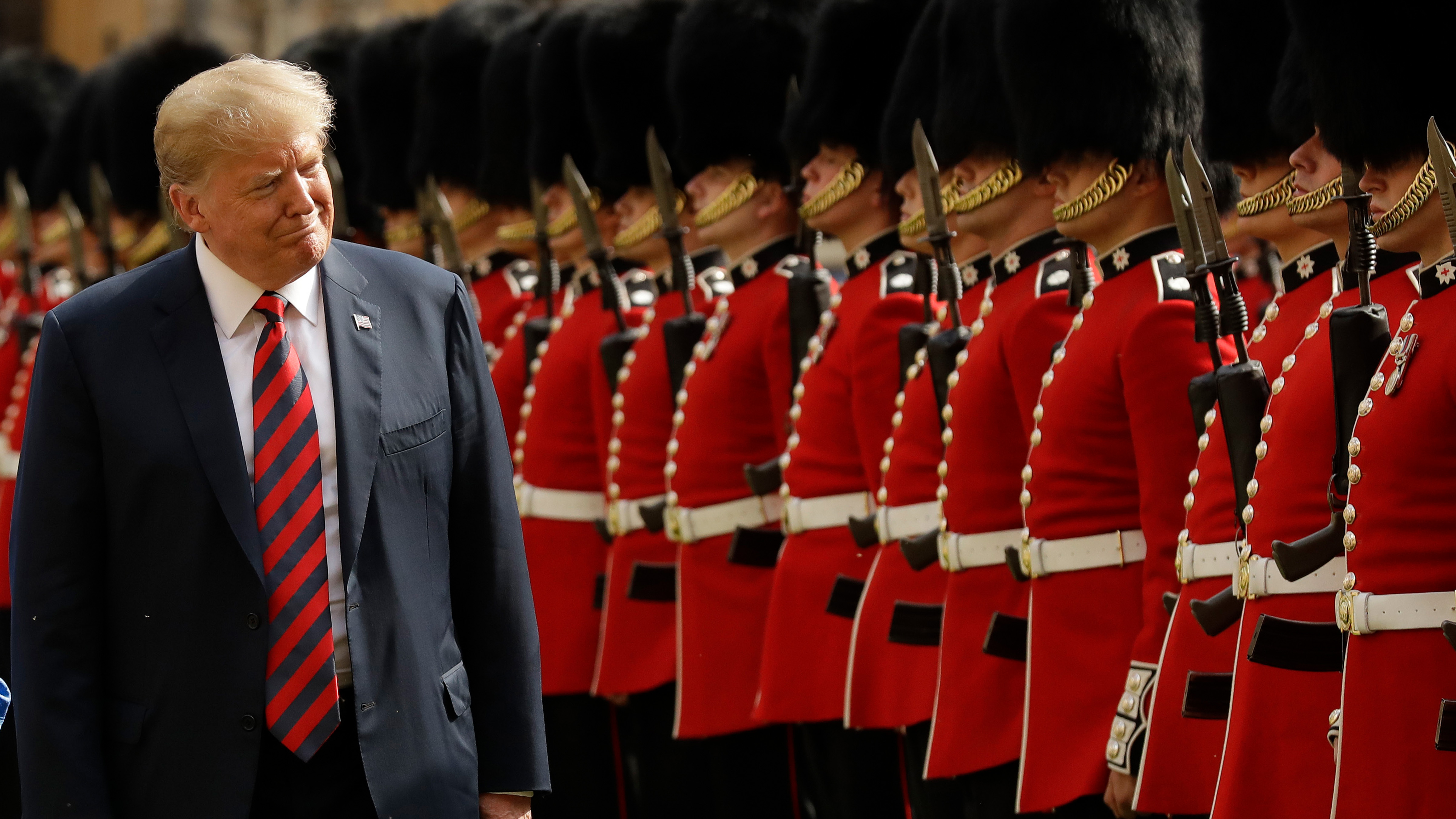 U.S. President Donald Trump inspects a Guard of Honour, formed of the Coldstream Guards at Windsor Castle in Windsor, England, Friday, July 13, 2018.