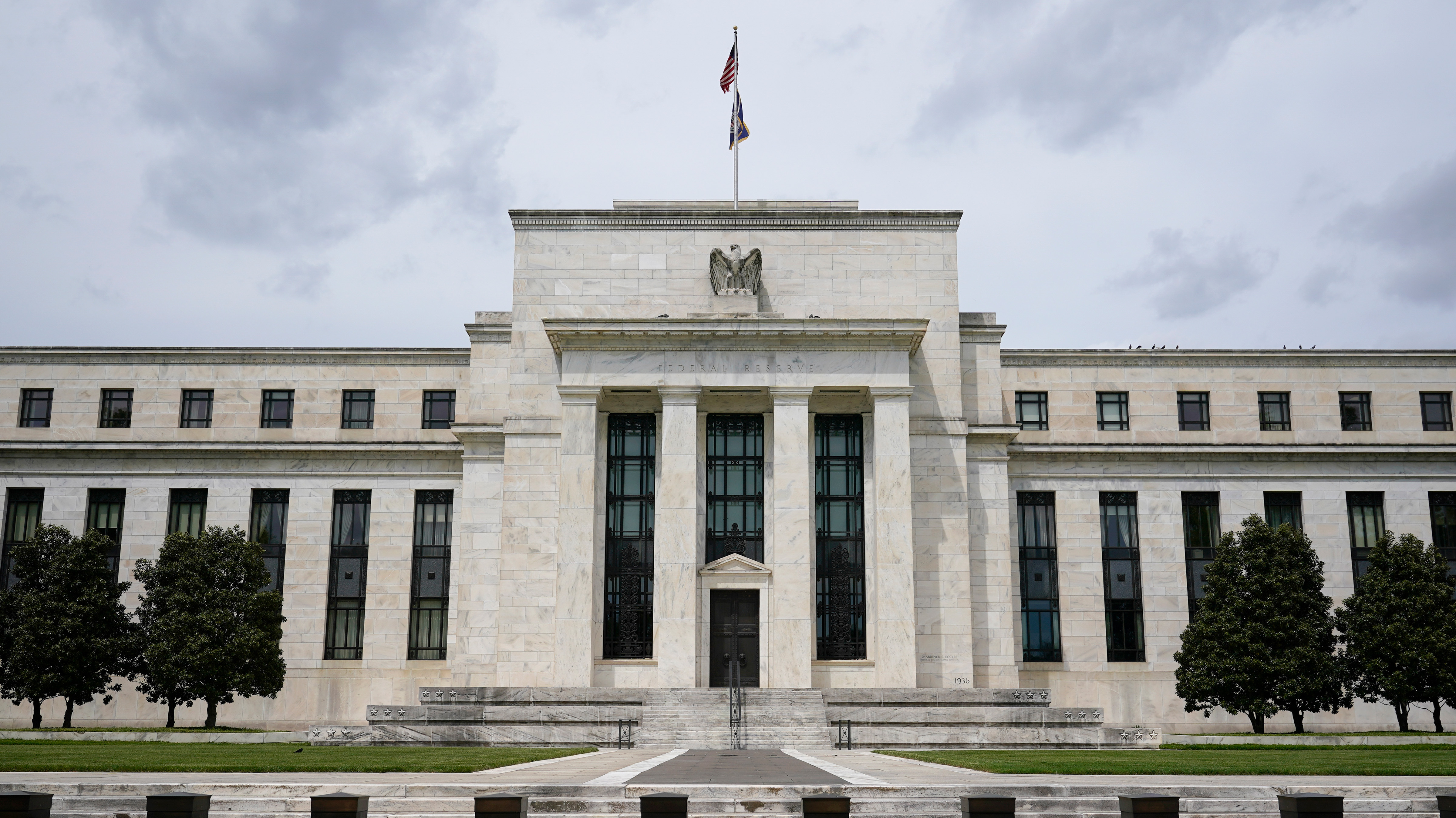 A U.S. flag flies over the Federal Reserve building on May 4, 2021, in Washington. 