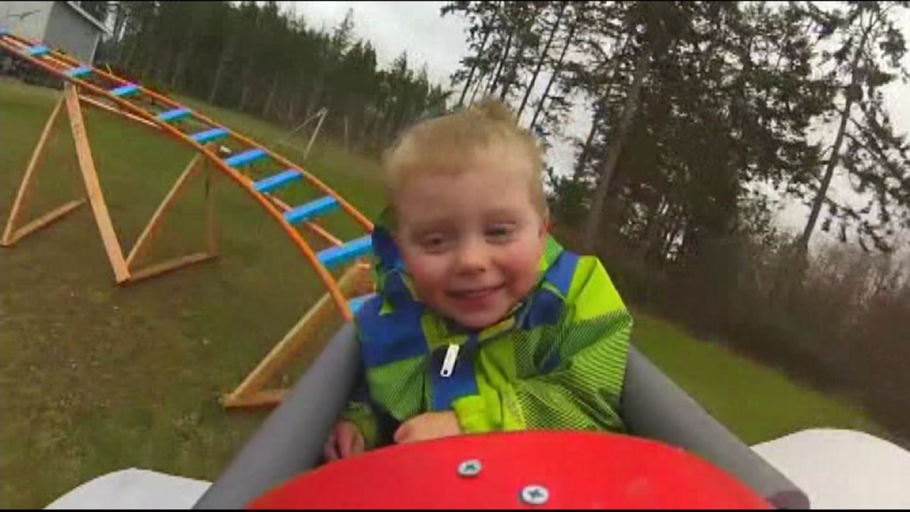 Dad builds backyard roller coaster to help bond with son