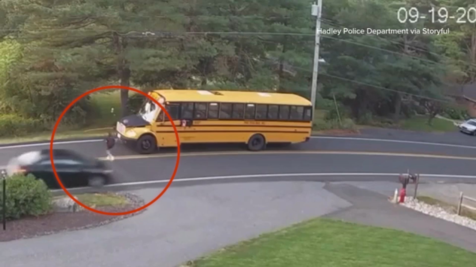 Student almost hit as driver ignores school bus stop sign, video shows