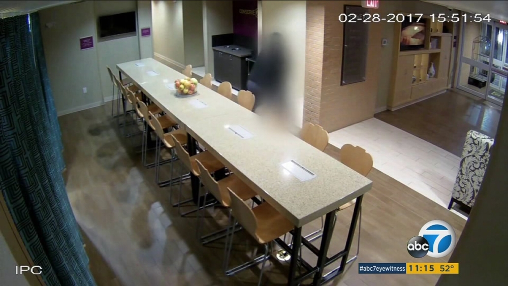 VIDEO: Man in mask lurks hotel halls, attacks front desk worker