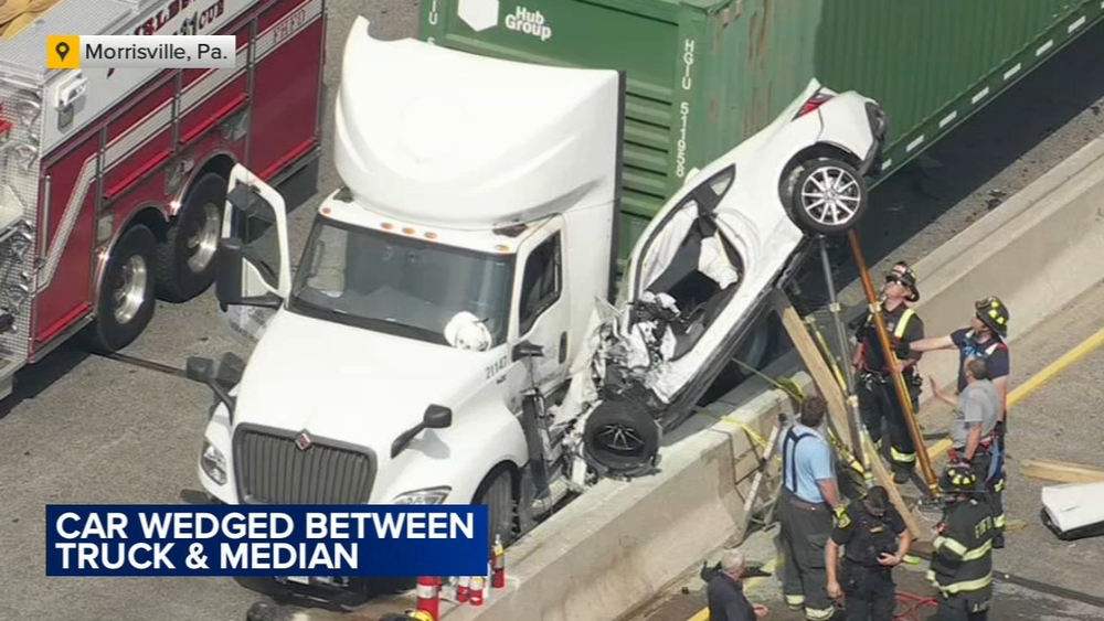 Car wedged between tractor-trailer and concrete median after crash on Route 1 in Bucks County
