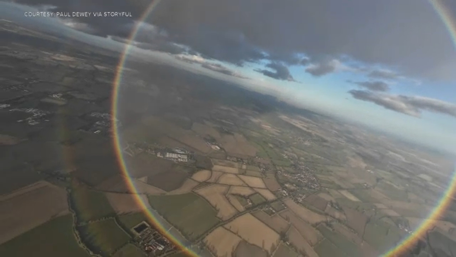 True shape of rainbow revealed to skydivers in magical airborne moment